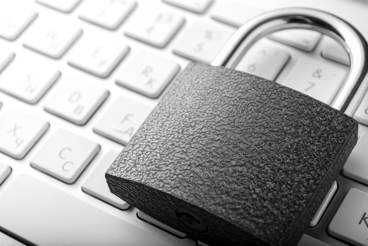 Padlock lying on the computer-keyboard