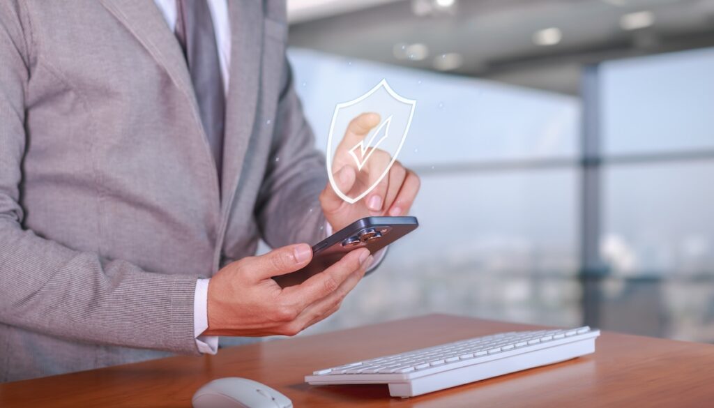 Cybersecurity and privacy protection for smartphone users. Businessman using cybersecurity technology to surf the Internet.